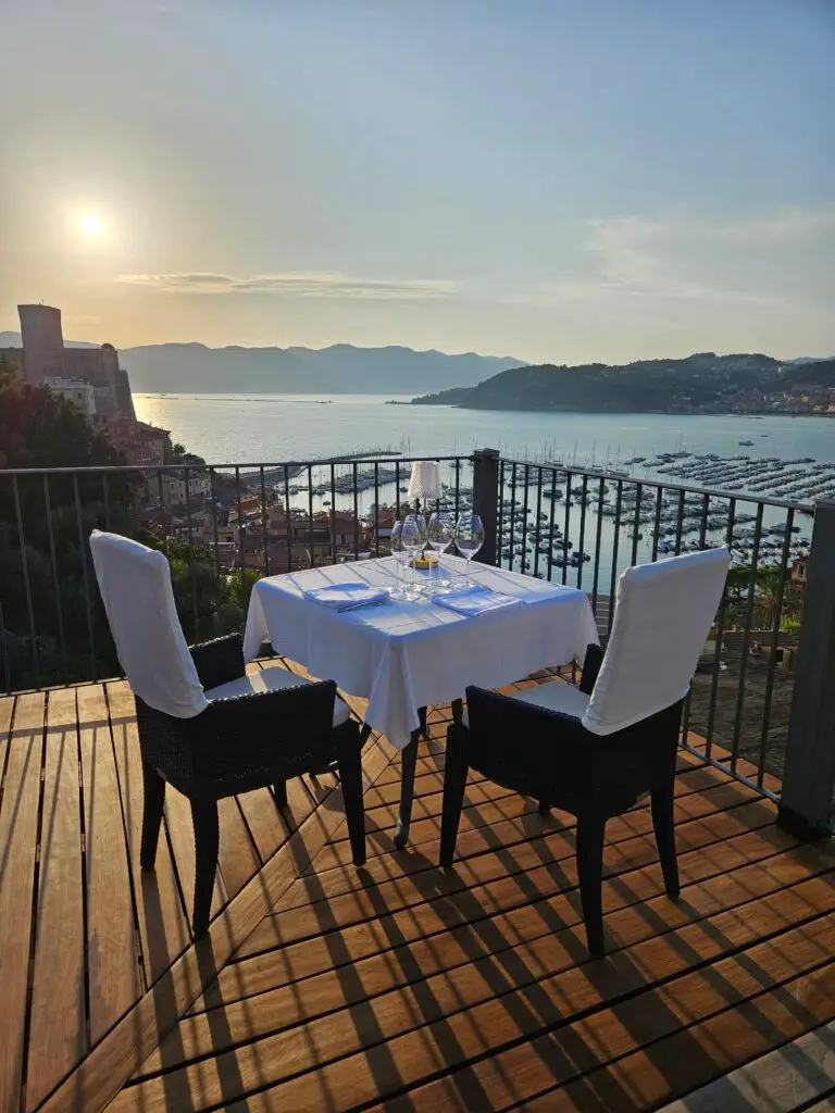 Fancy dinner table set up overlooking The Pet's Gulf waters.