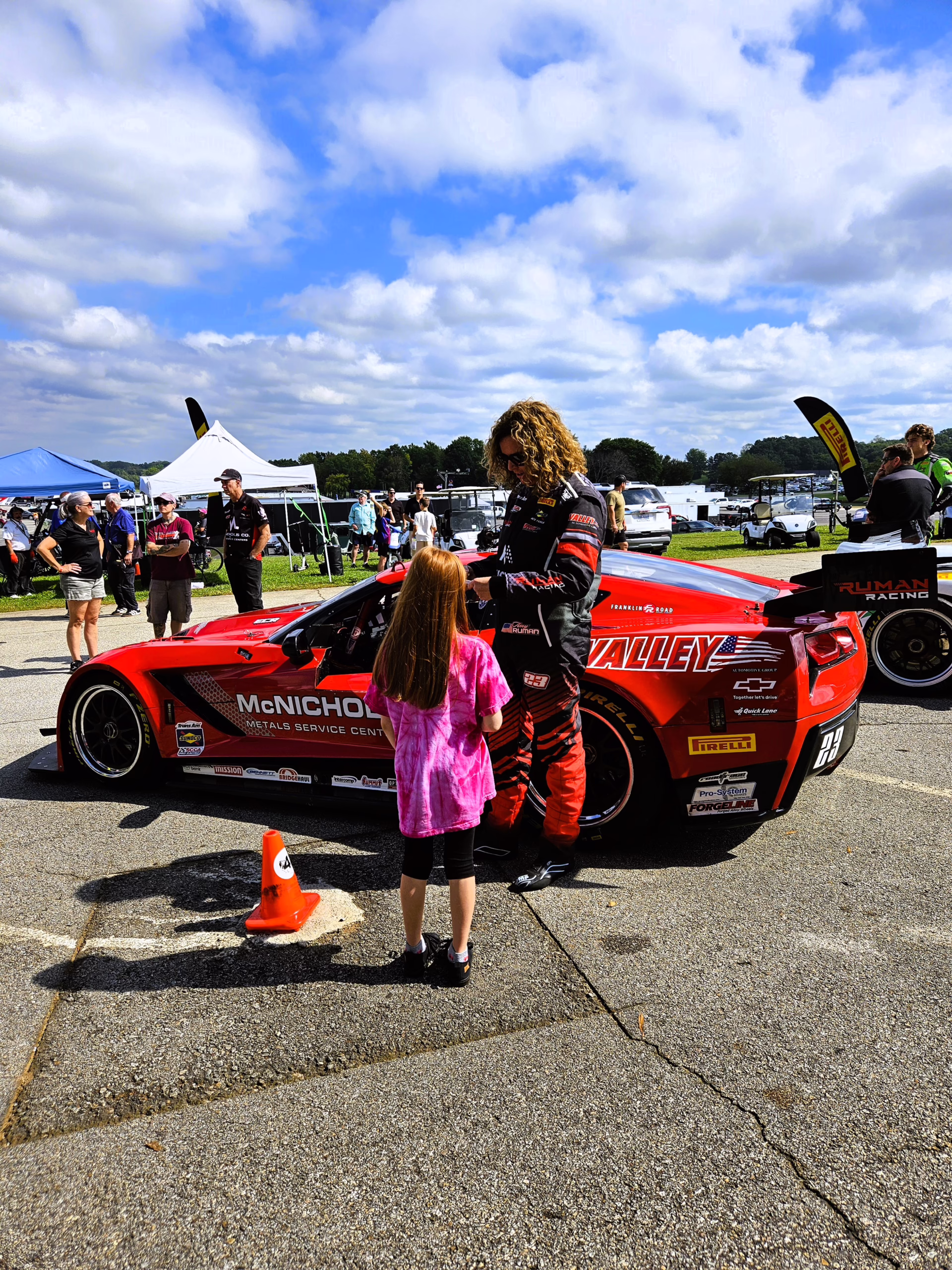 Photo of girl meeting a female racecar driver at a family- friendly racetrack in Virginia: VIR