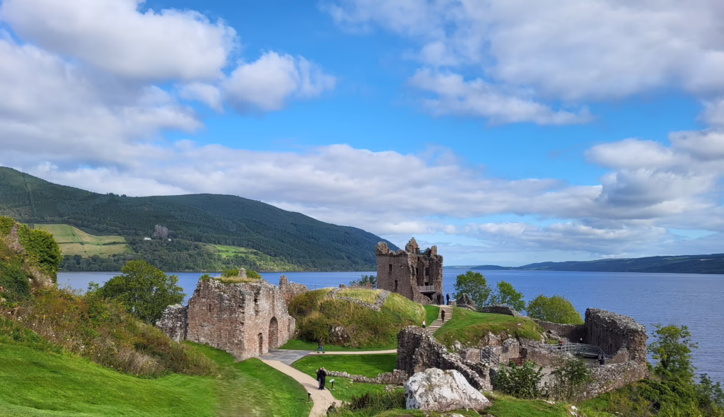 Scotland Road Trip Itinerary must: A photo of Urquhart Castle overlooking Loch Ness in Scotland.